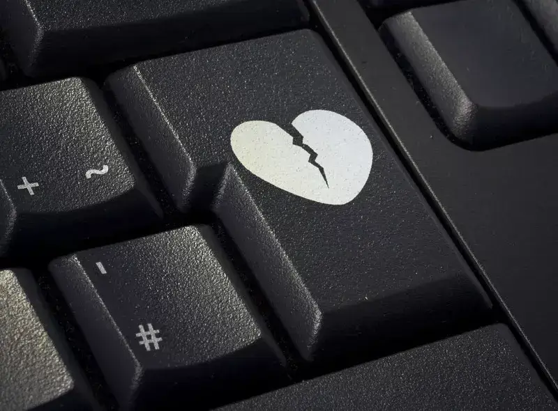 keyboard showing broken heart on return key