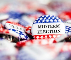 Midterm election button surrounded by other buttons