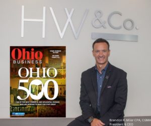 Brandon Miller sitting next to Ohio Business Magazine.