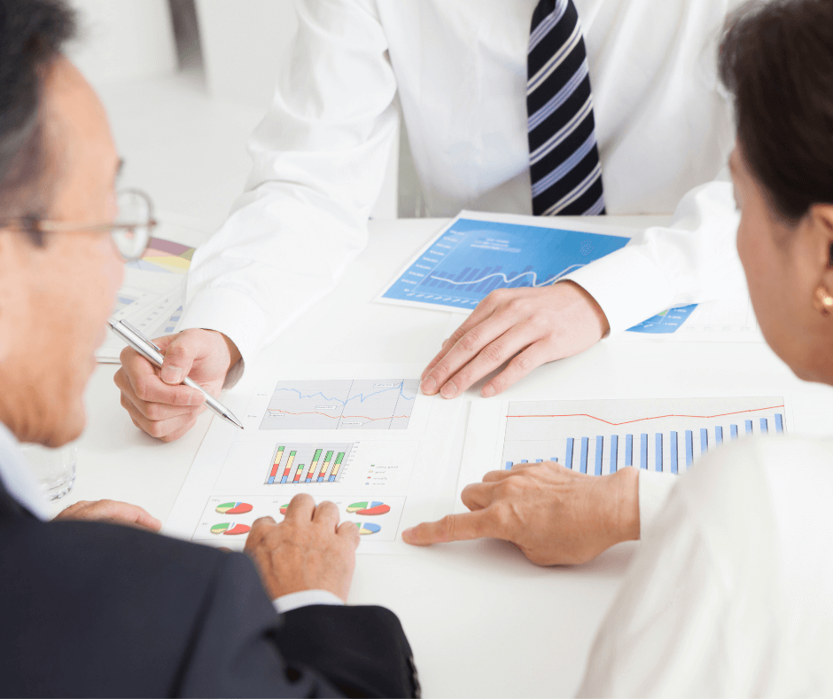 man pointing at business documents in meeting